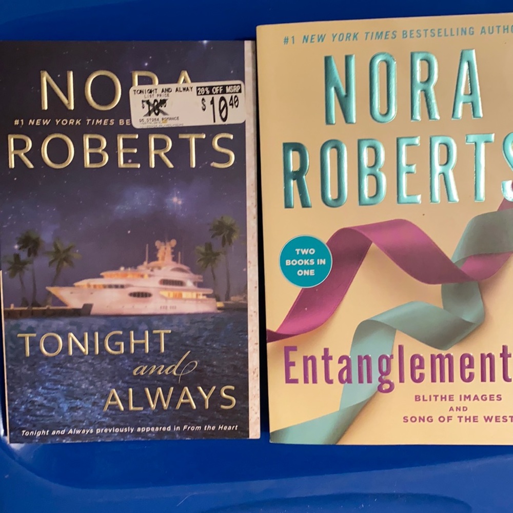 Two large soft cover Nora Roberts books